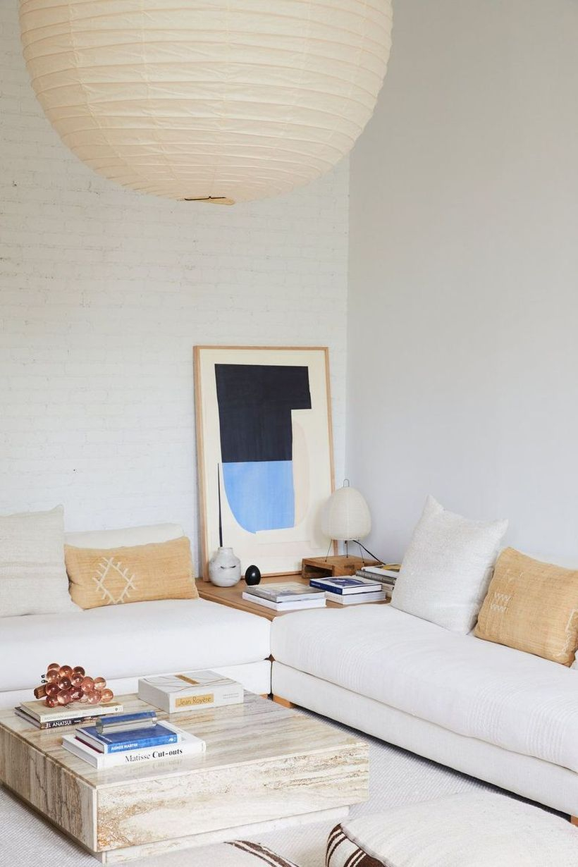 Brown and white cushion with white sofa