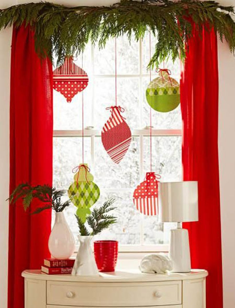 Christmas window with colorful hanging ornament