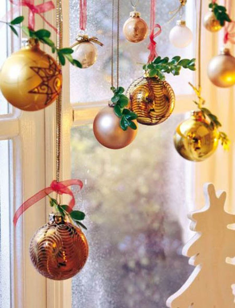 Christmas window with gold hanging lamps ornament