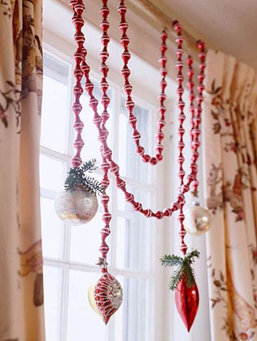 Christmas window with red and white hanging lamps