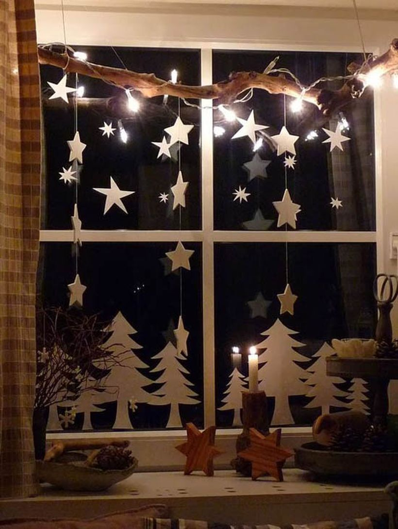 Christmas window with white tree and small white stars
