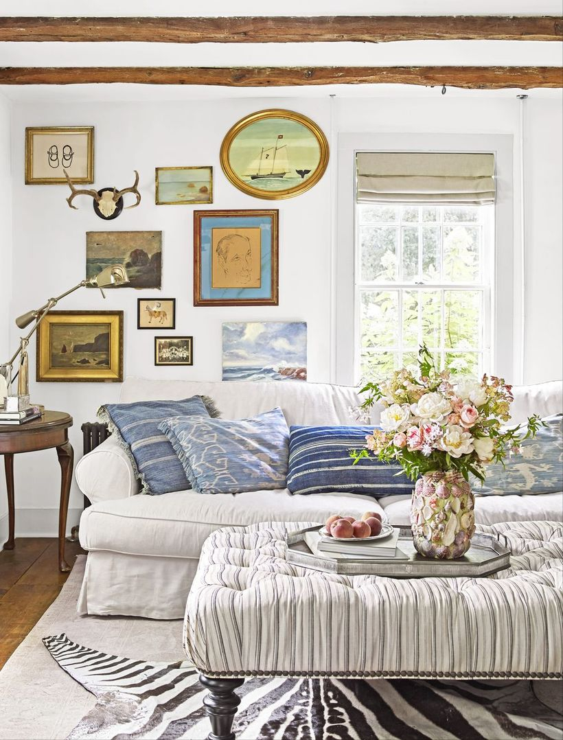 White stripped in the blue cushion with white sofa and stripped sofa table