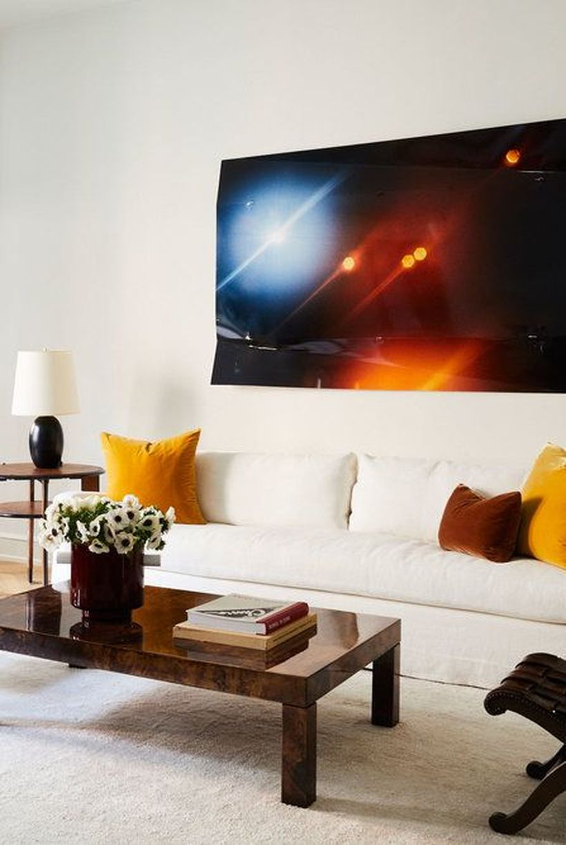 Yellow and brown cushion with white sofa