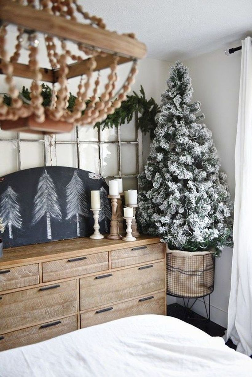 07-a-small-flocked-christmas-tree-in-a-metal-wire-basket-with-no-decor-at-all-it-looks-cool-without-it