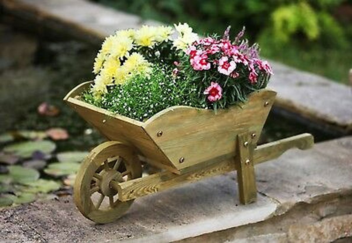 A-small-wooden-train-coupled-with-colorful-flower-plants-that-are-very-charming