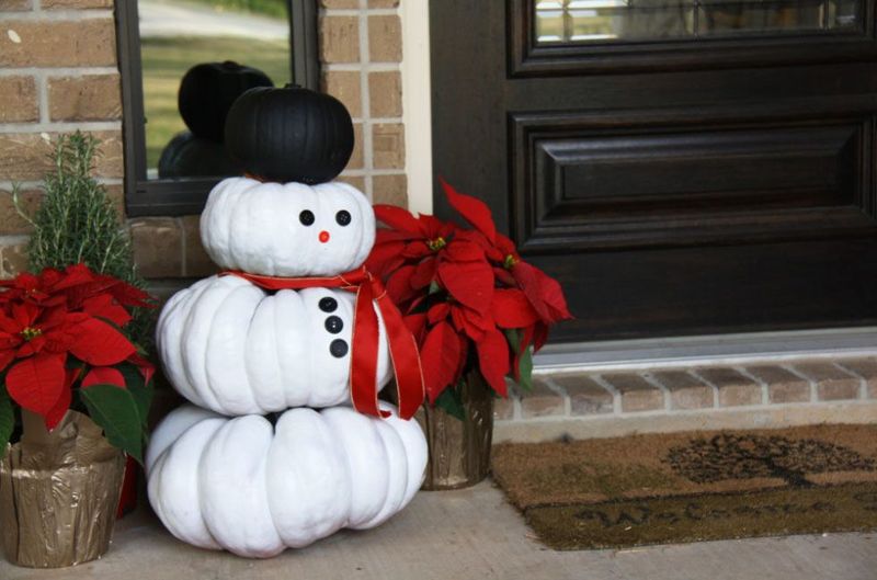 A-trio-of-mini-pumpkins-becomes-a-snowman-who-can-welcome-guests-to-your-home-minus-the-freezing-winter-temps.