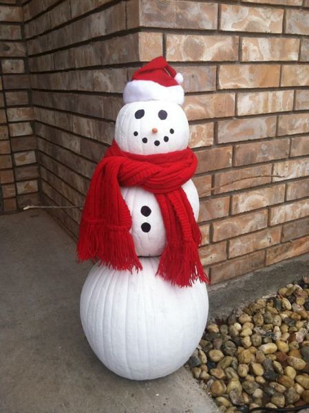 Amazing-pumpkin-outdoor-decoration-snowman-with-snowman-of-big-pumpkins-paints-a-scarf-and-a-beanie.