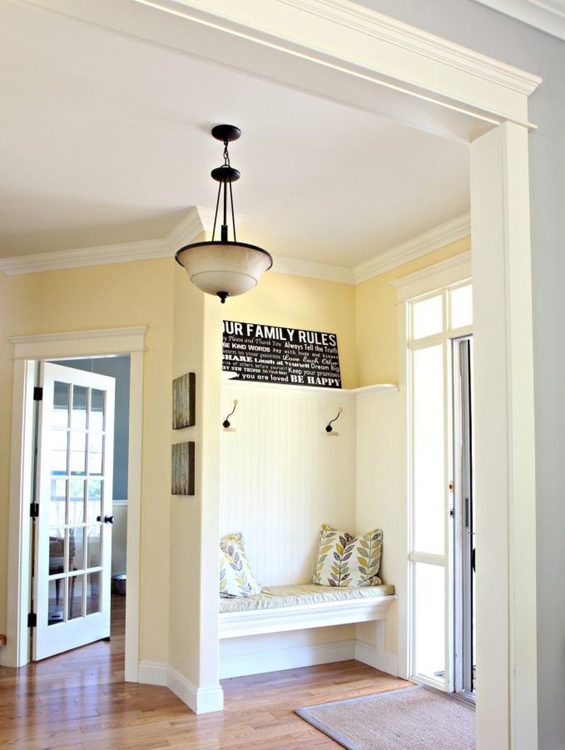 Best-yellow-paint-colour.-benjamin-moore-buttermilk.-oak-flooring.-country-style-foyer-entryway-with-built-in-bench-and-hooks.-kylie-m-e-design-online-colour-consultant-683x1024