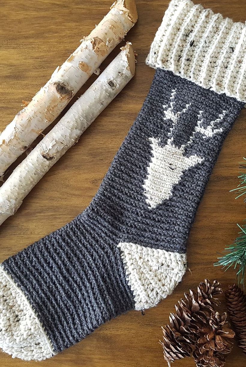 Classic-christmas-décor-ideas-with-this-wintry-reindeer-stocking.-you-can-even-add-a-red-button-for-rudolphs-nose.