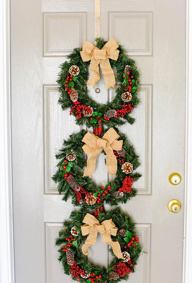 Welcoming-christmas-front-door-with-wreath-trio-to-welcome-and-charm-every-guest-you’ll-have.-1