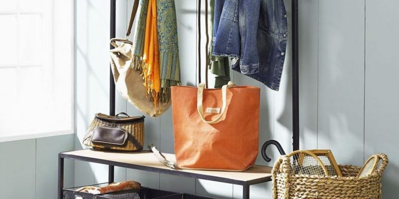 Laundry-basket-storage-under-entryway-bench-seat-with-clothing-and-coat-hooks-beside-rattan-umbrella-stand-ideas-783x783