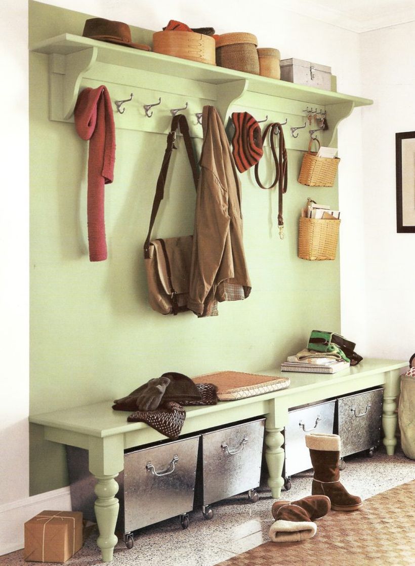 Light-green-wood-entryway-bench-seat-design-with-coat-rack-and-clothing-hooks-above-metal-basket-storage-with-wheels-ideas-783x1068