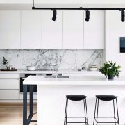 1-black-and-white-kitchen-with-white-marble-backsplash-via-cortese-architects