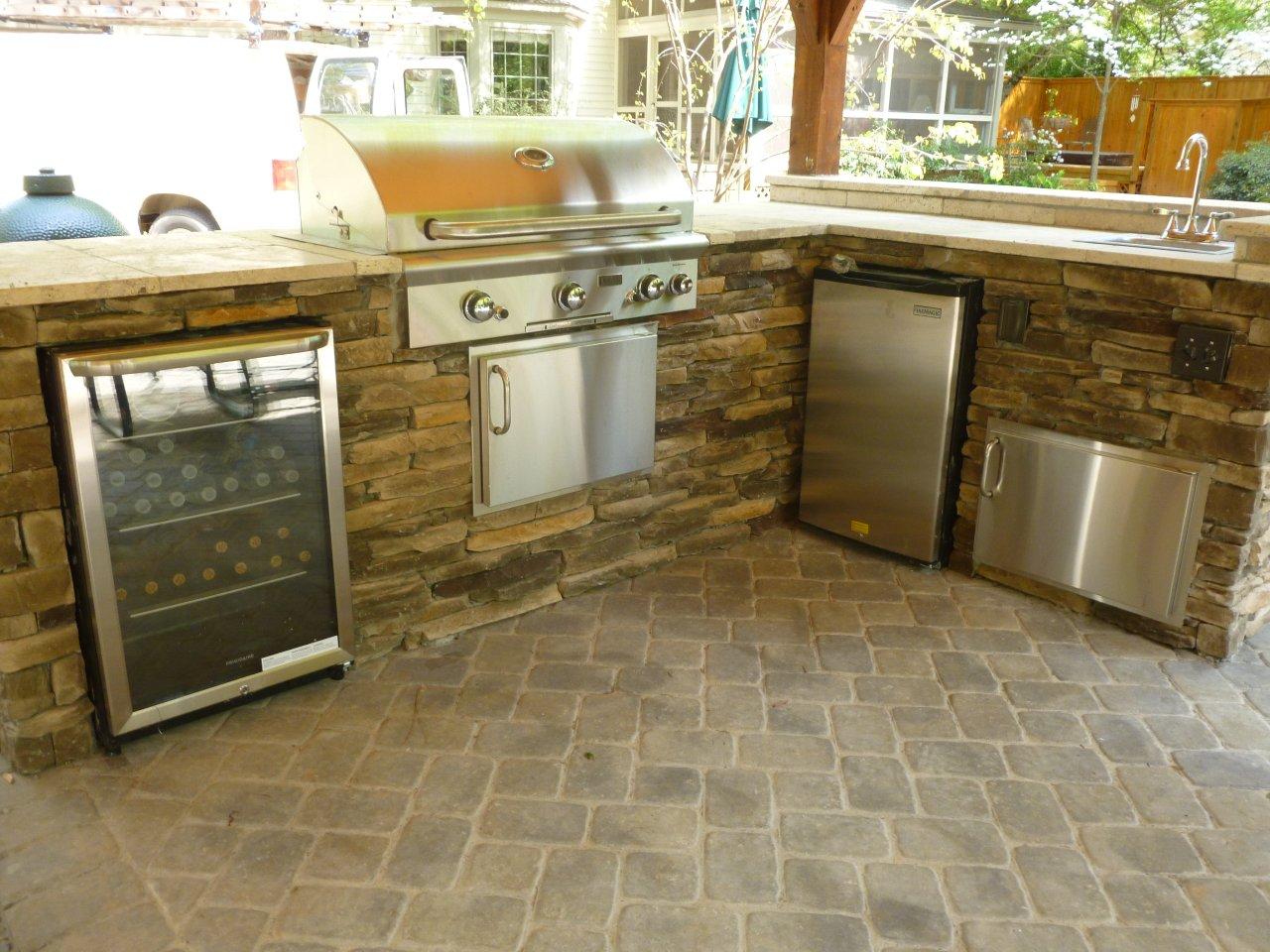 1-kitchen-with-wine-refrigerator-grill-and-travertine-counter-top-copy