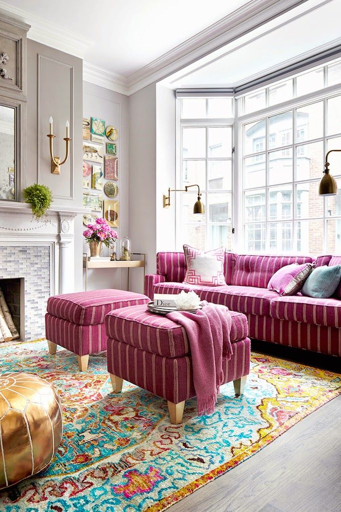 1-pink-sofa-and-ottomans-on-colorful-rug