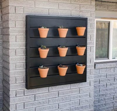 Backyard-vertical-garden-pots-on-exterior-of-house-683x1024-1