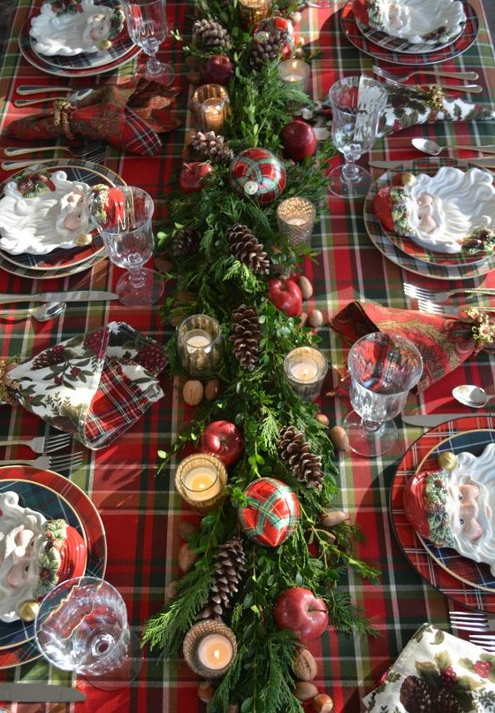 05-a-plaid-tablecloth-a-greenery-table-runner-with-pinecones-apples-plaid-ornaments-and-mercury-glass-candle-holders