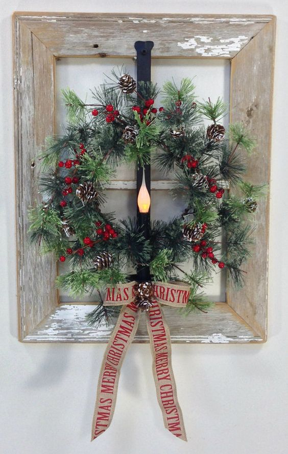 13-a-window-frame-wreath-of-faux-evergreens-berries-and-pinecones-with-a-burlap-bow-and-a-light