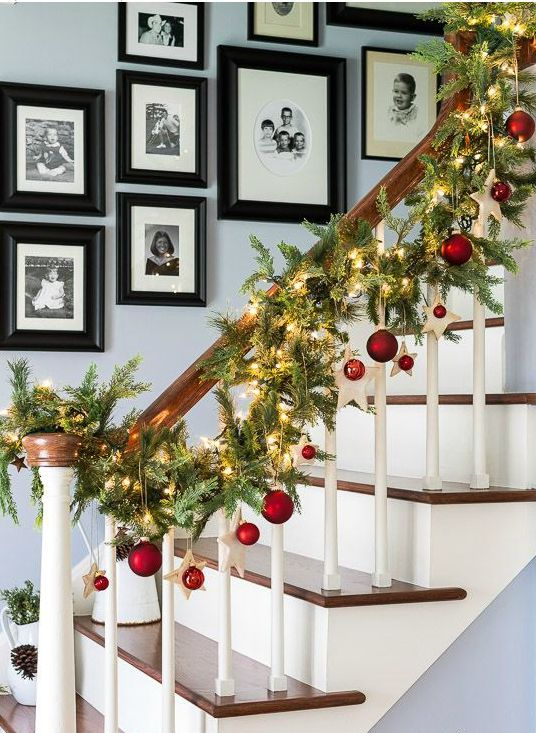 20-an-evergreen-garland-with-lights-stars-and-red-ornaments-to-line-up-the-stairs