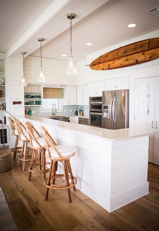 14-an-old-surf-attached-to-the-wall-in-the-kitchen-opposite-the-breakfast-area