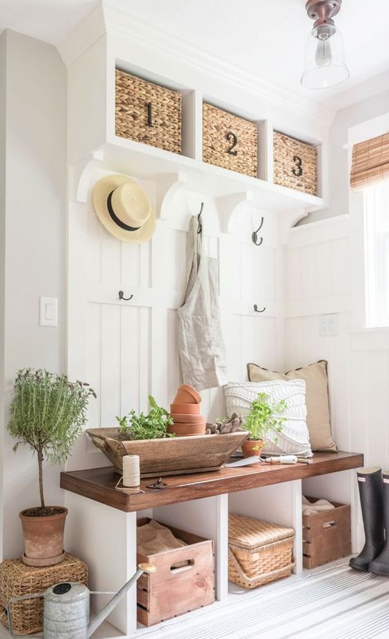 15-a-storage-bench-with-potted-plants-and-a-wooden-bowl-with-greenery-and-planters
