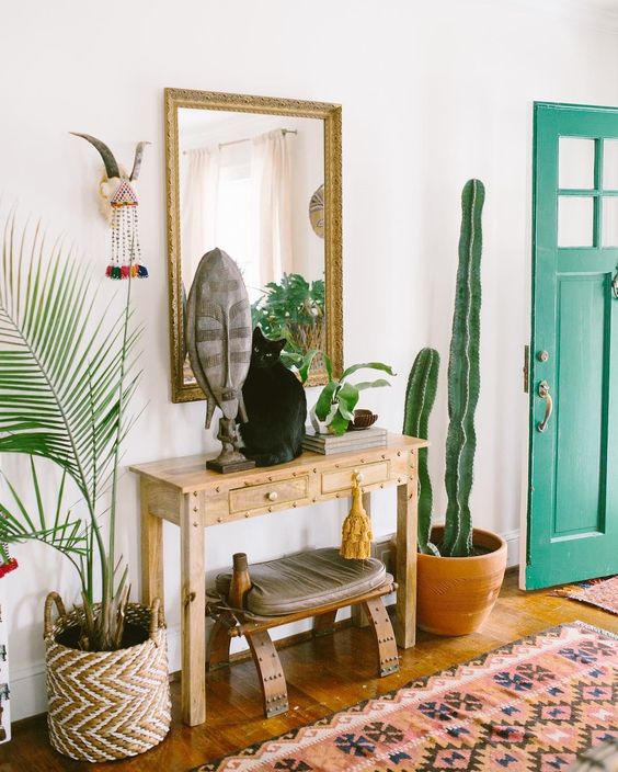 16-a-boho-rug-a-console-a-stool-a-mirror-some-plants-and-a-cactus-plus-folk-decor-for-a-boho-feel