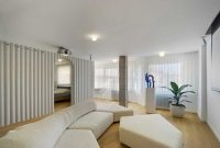 Contemporay white apartment with an open living space that feels dramatic 2