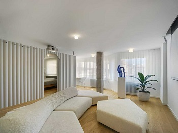 Contemporay white apartment with an open living space that feels dramatic 2