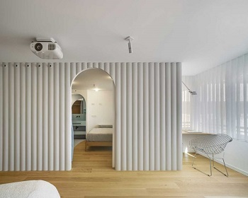 Contemporary white apartment with an open living space that feels dramatic 3