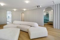 Contemporary white apartment with an open living space that feels dramatic 4