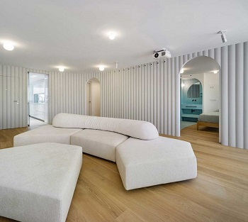 Contemporary white apartment with an open living space that feels dramatic 4