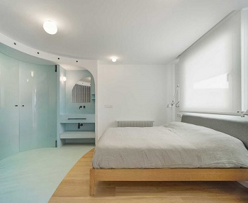 Contemporary white apartment with an open living space that feels dramatic 5