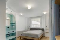 Contemporary white apartment with an open living space that feels dramatic 6