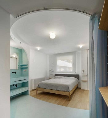 Contemporary white apartment with an open living space that feels dramatic 6