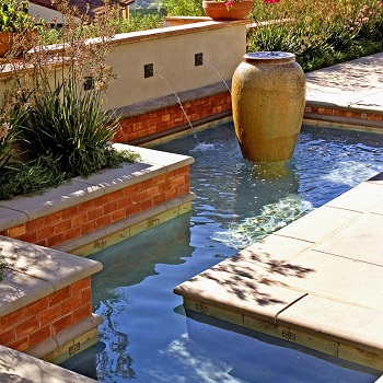 Urn-like fountain in a garden pool Innovative Landscape Ideas For Water Features To Create A New Look