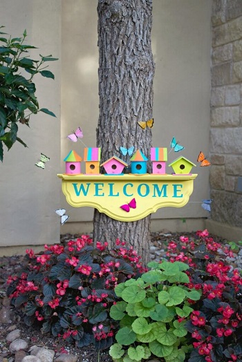 Cheery birdhouse welcome sign