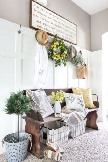 Greenery wreath over the bench