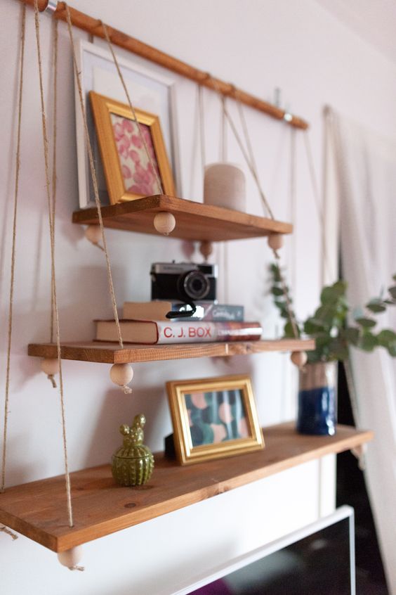 2-12-a-boho-hanging-shelf-composed-of-several-tiers-of-various-sizes-beads-on-a-wooden-holder