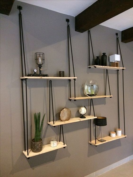 2-22-a-whole-hanging-shelving-unit-with-several-shelves-and-black-ropes-looks-very-contrasting-and-will-fit-any-boho-room