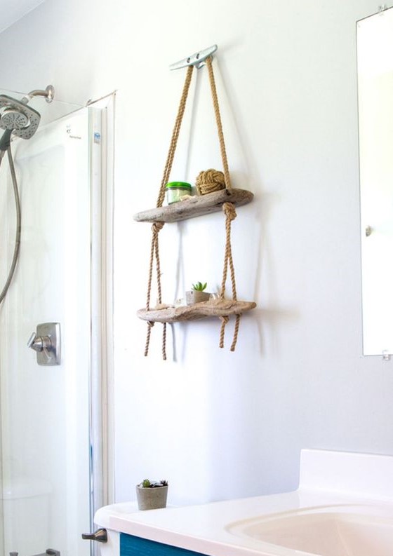 2-26-a-small-hanging-display-shelf-for-a-bathroom-made-of-driftwood-and-ropes-will-add-decorative-value-to-the-space-1