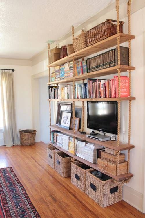 4-16-a-large-hanging-shelving-unit-with-thick-rustic-wooden-shelves-and-thick-ropes-plus-baskets-under-it-for-more-organization