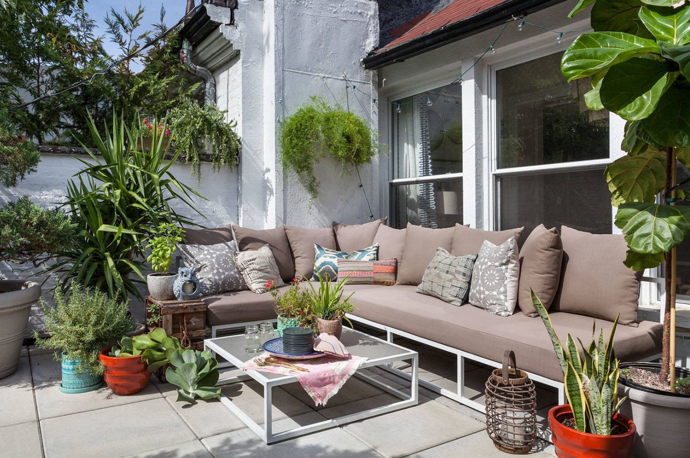 Frame-style-couch-and-plants-arround-patio