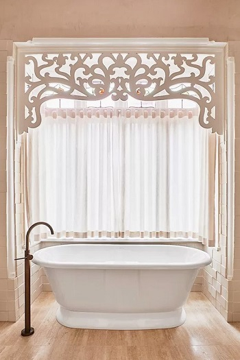 Pink bathroom with stained glass window