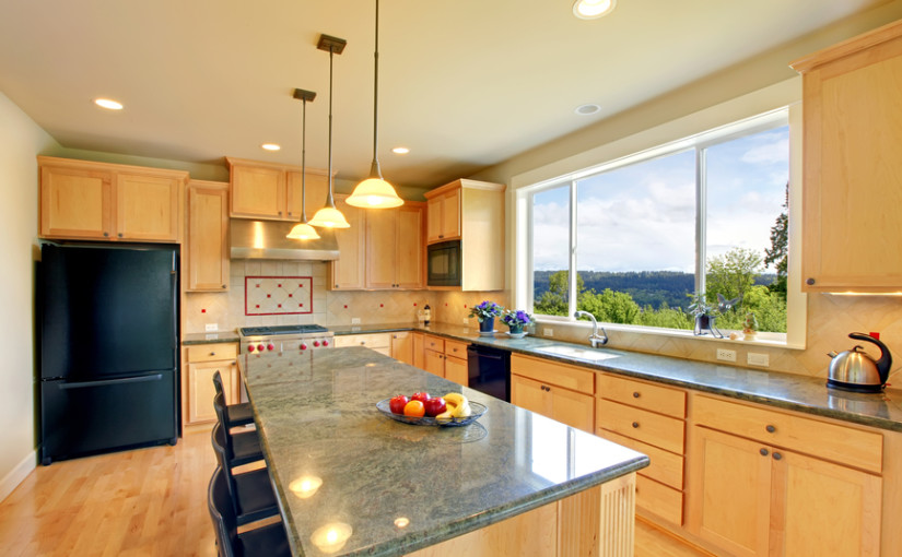 Luxury classic wood kitchen with island and chairs.