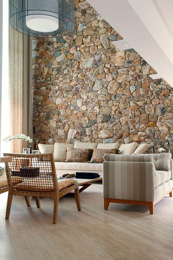 A-rough-stone-accent-wall-adds-a-natural-feel-to-the-contemporary-living-room-and-brings-a-touch-of-natural-color