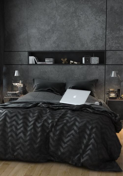 Modern-bedroom-with-a-wall-niche-mirror-nighstands-and-cool-black-bedding