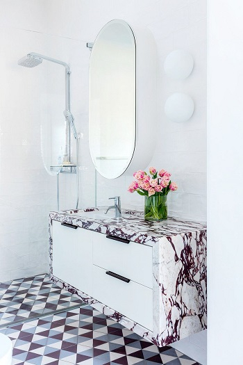 With deep burgundy-pink marble