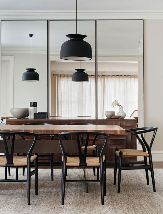 2-12-a-trio-of-three-tall-mirrors-makes-the-dining-room-look-bigger