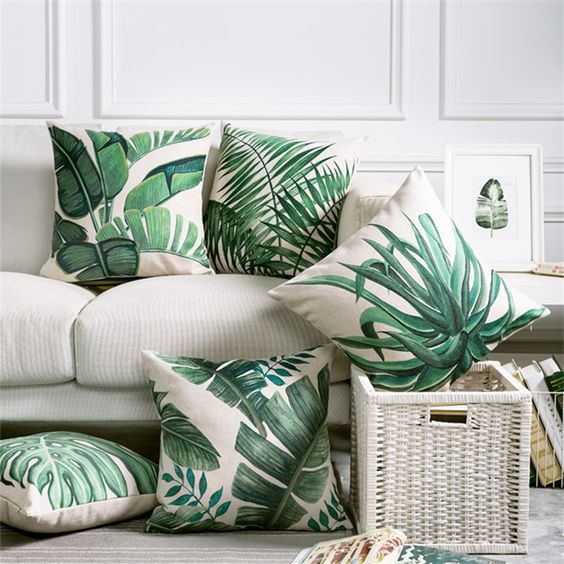 3-02-a-selection-of-torpical-leaf-print-pillows-is-a-budget-savvy-way-to-brighten-up-the-space