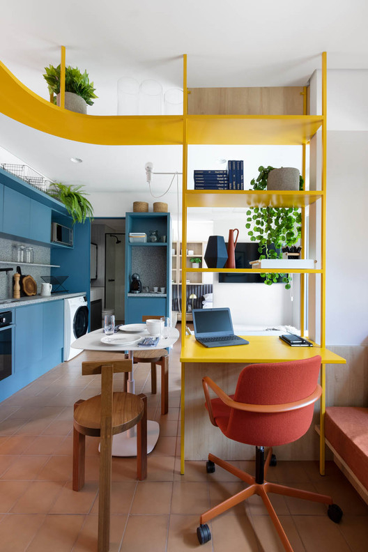 Apartment interior design in 37 m² area with a tiny home office nook 4